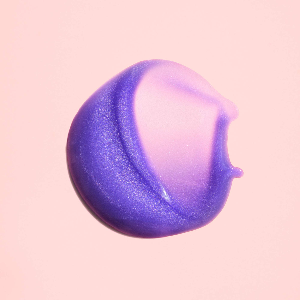 ORIBE texture on hand demonstrating lightweight serum absorption benefit