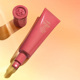 ORIBE product texture on hand showing lightweight feel and immediate hydration benefit