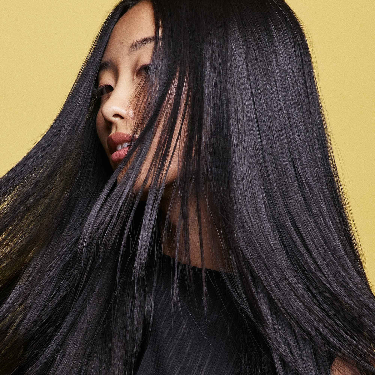 Oribe creamy conditioner texture closeup showing rich hydration and smoothness