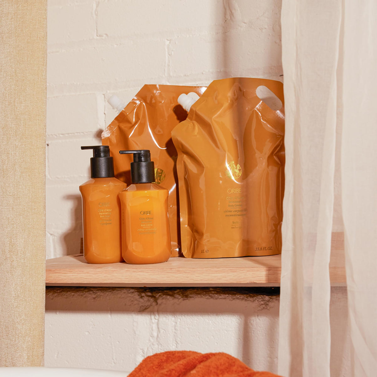 ORIBE pouch on bathroom shelf styled to show elegant daily routine