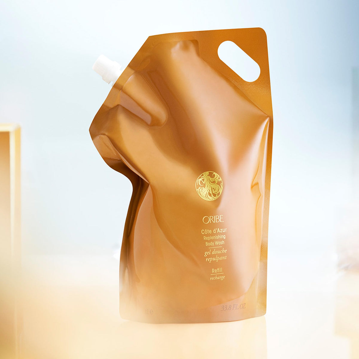ORIBE pouch staged with jasmine and bergamot illustrating scent notes