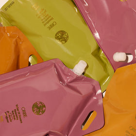 ORIBE refill packaging with recycling symbol emphasizing reduced plastic use