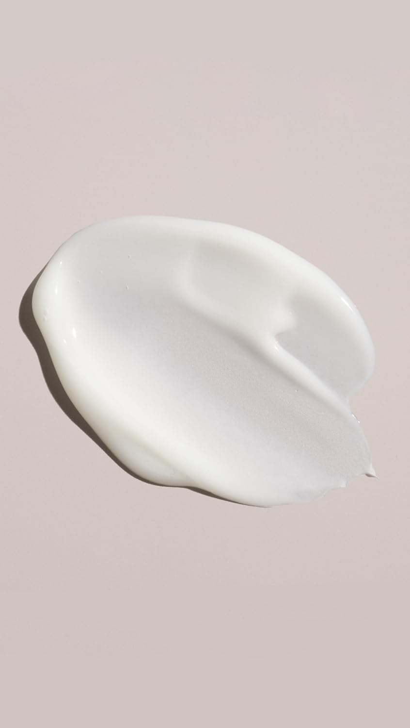 Oribe gel-crème texture on hand demonstrating lightweight conditioning