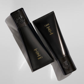 ORIBE small dab smoothed over dry hair to tame frizz and add shine