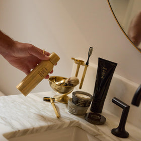 ORIBE product staged with lifestyle props showing luxury everyday use