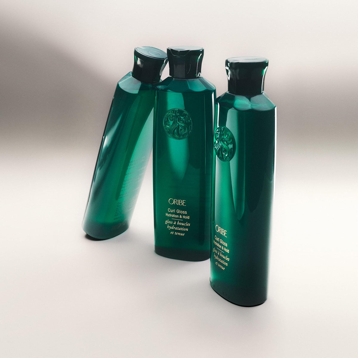 ORIBE bottle in hand for scale, demonstrates travel-friendly 5.9 fl oz size
