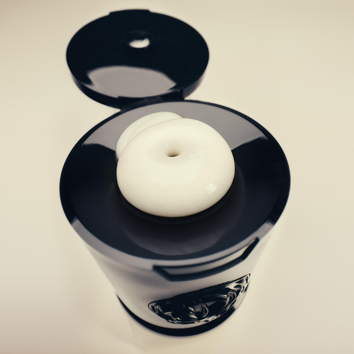 Oribe cypress extract droplet highlighting botanical repair benefits
