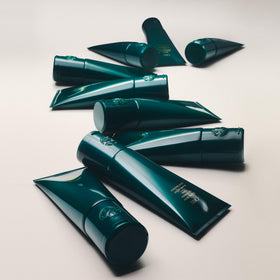 Oribe defined curls after use showing reduced frizz and natural bounce