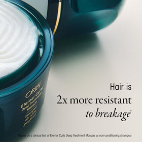 Applying Oribe mask to towel-dried hair demonstrating easy detangling