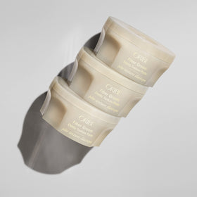 Oribe Fiber Groom close-up texture on finger highlighting airy fibers and control