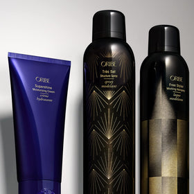 Oribe in use stylist applying spray for touchable, brushable finish