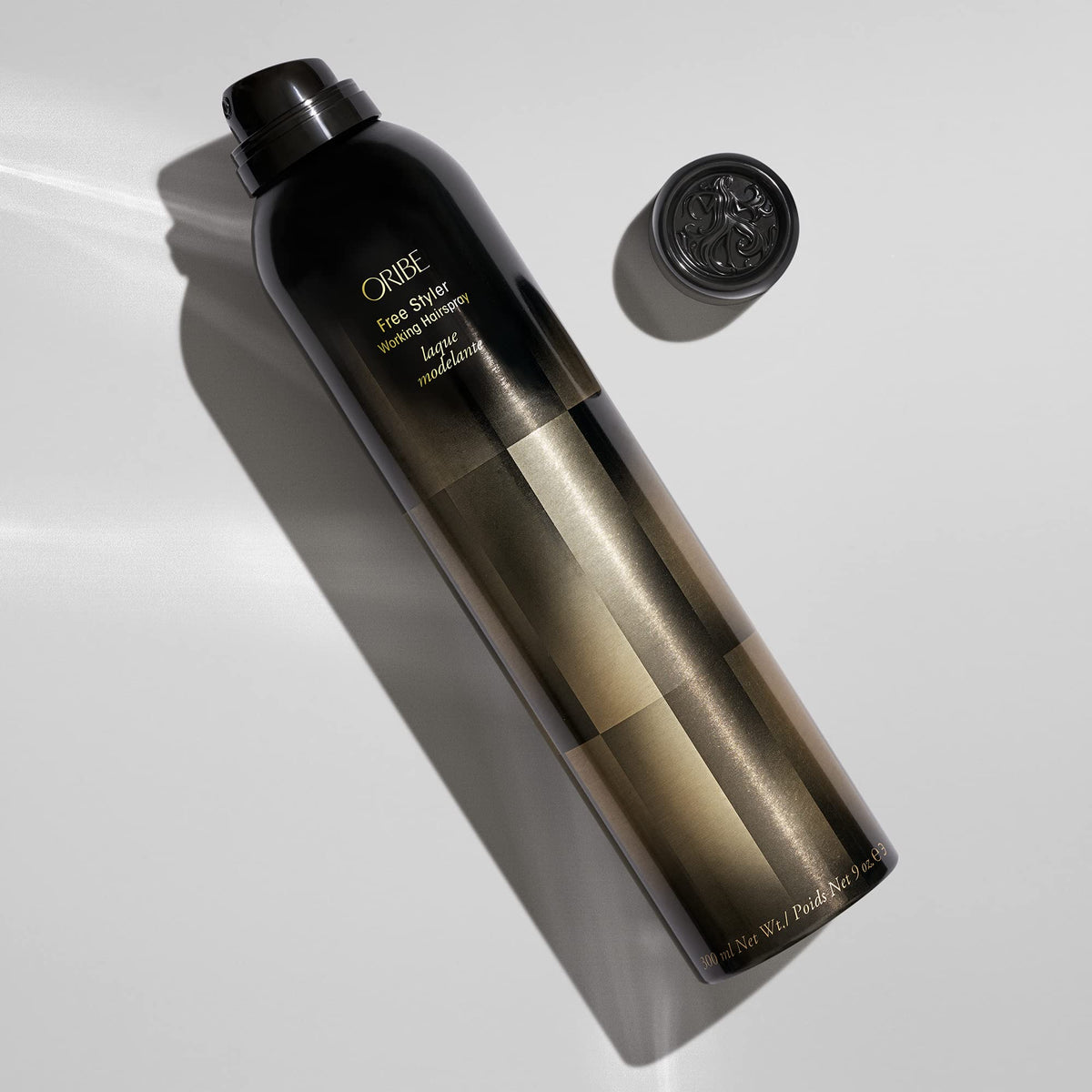 Oribe mist texture close-up demonstrating ultra-fine spray for even hold