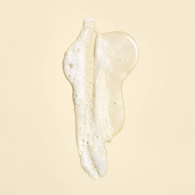 Oribe Gold Lust in-shower application on wet hair illustrating restorative use and smooth results