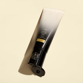 Oribe Gold Lust mask label close-up lists benefits and vegan, cruelty-free claims