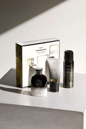 Gold Lust Shampoo close-up bottle label and texture, showing nourishing benefits by Oribe