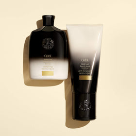 Oribe Gold Lust shampoo in shower setting illustrating easy everyday use