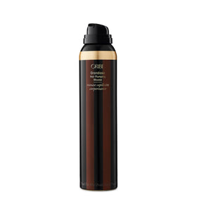 Oribe Grandiose close-up of mousse texture illustrating lightweight, hydrating foam