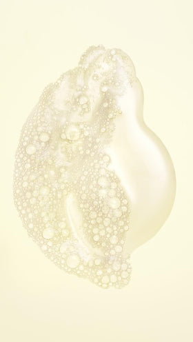 Oribe creamy lather texture demonstrating gentle cleansing and moisture retention