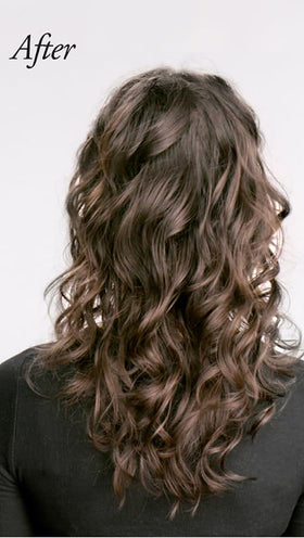 Oribe conditioner being applied in shower to detangle and reduce breakage