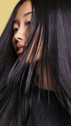 Oribe Hair Alchemy trio on counter showing system synergy and strengthened hair