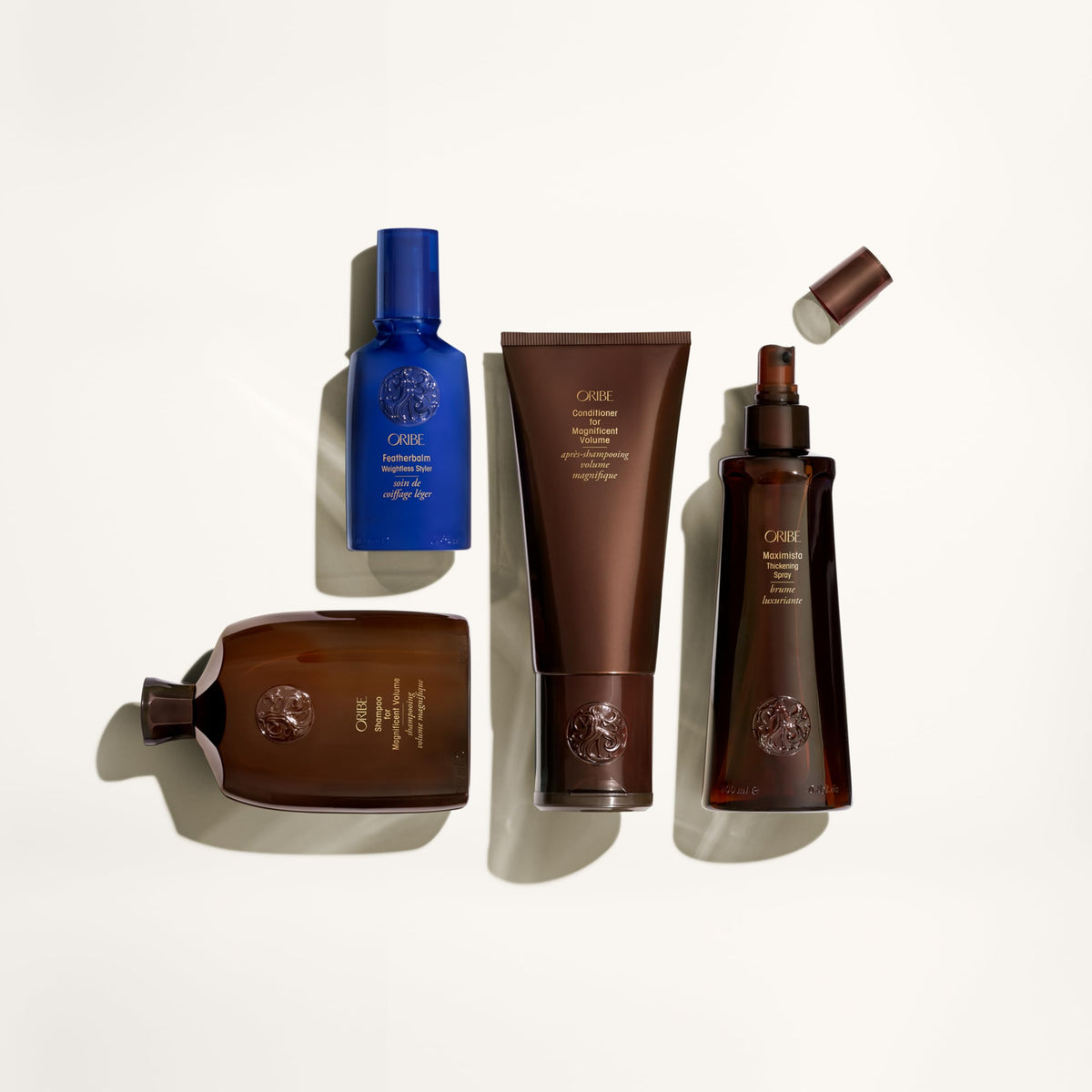 Oribe shampoo in shower on wet hair demonstrating volumizing lift and manageable strands