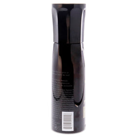 Oribe Invisible Defense being misted on hair for heat and UV protection
