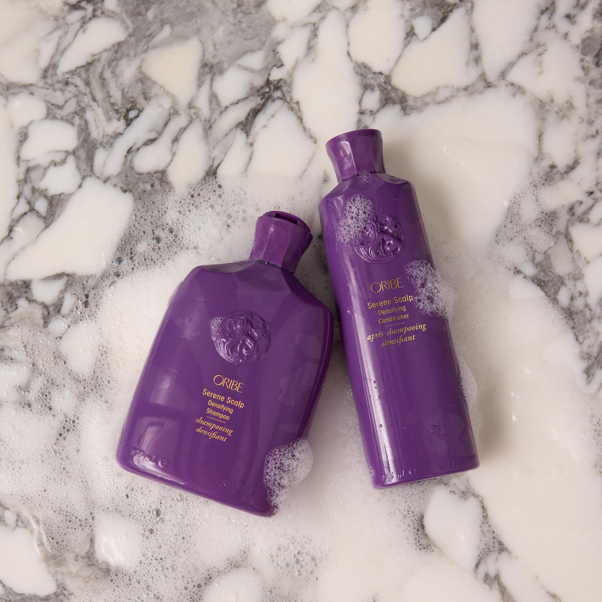 Oribe label close-up highlighting biomimetic peptide for scalp support and strength
