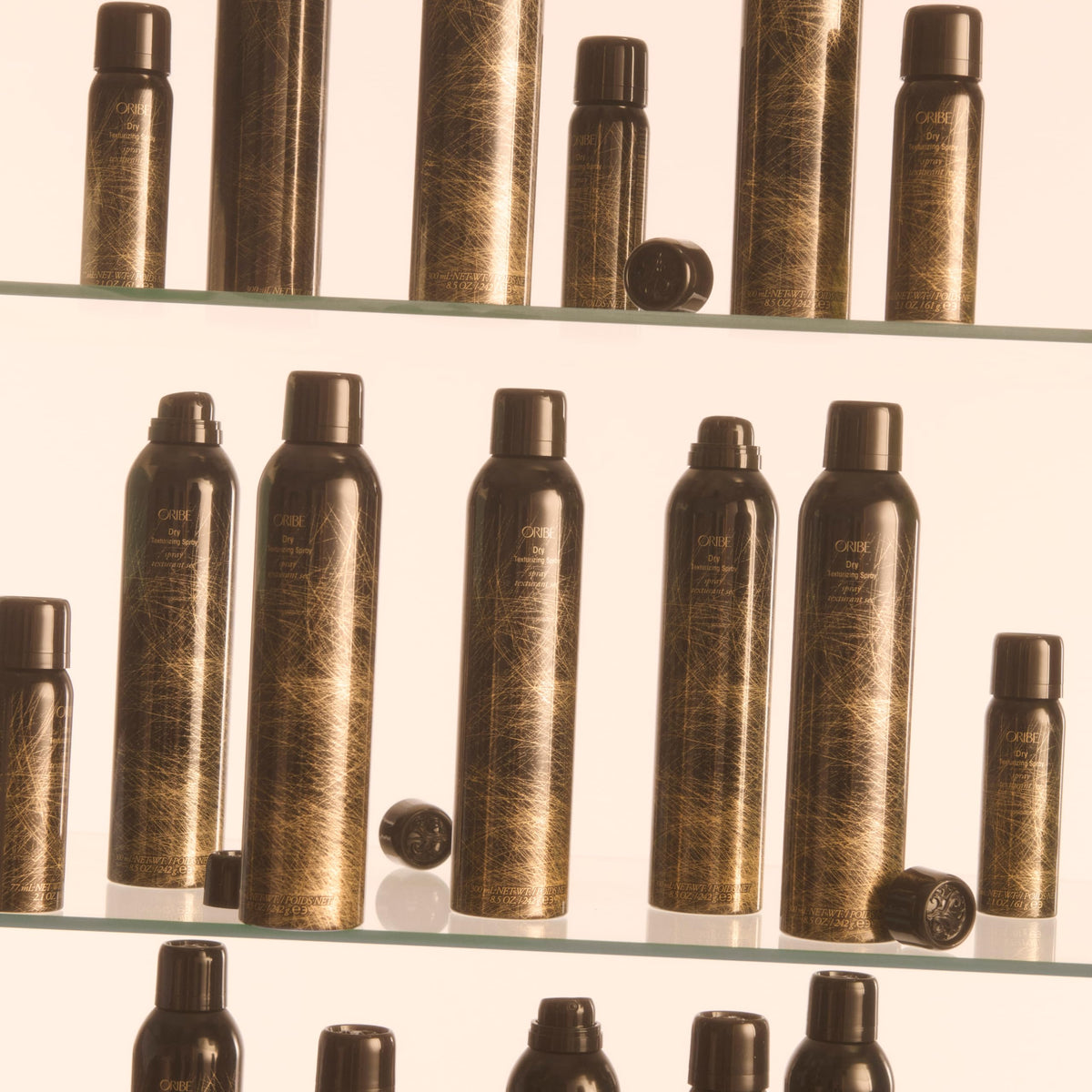 Oribe lifestyle hair model with voluminous styled hair illustrating lasting texture benefit
