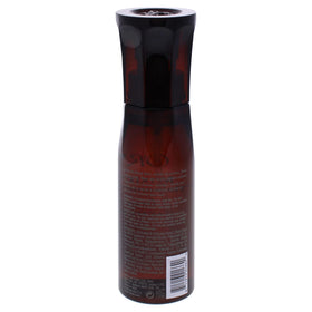 Oribe Maximista in use while blow-drying to create fuller, protected hair