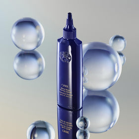 ORIBE model back-view showing glossy hair after use and reflective shine benefit