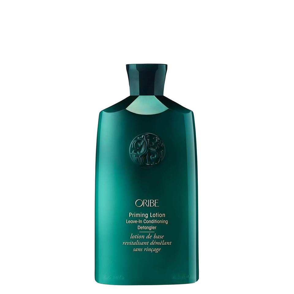 Oribe Priming Lotion front packaging showing sleek bottle and brand