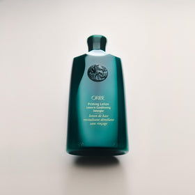 Oribe Priming Lotion before and after styling showing smoother, softer curls