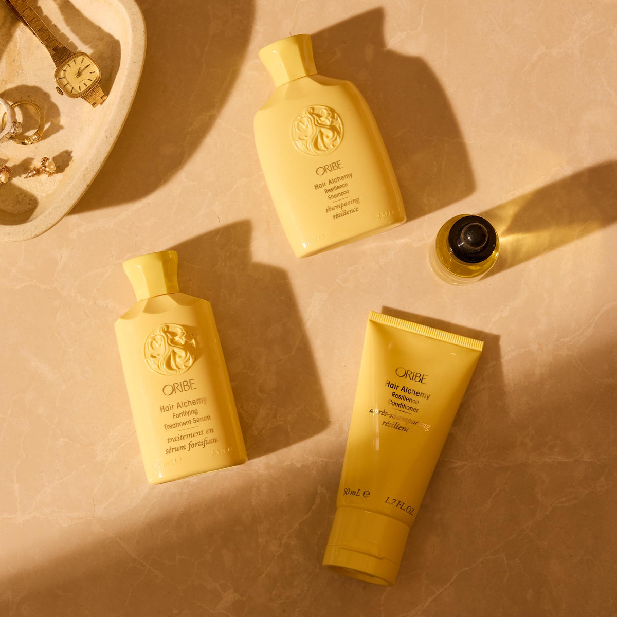 Oribe shampoo placed in a bathroom shelf scene suggesting elevated daily routine