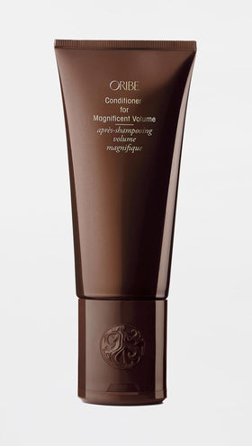 Oribe dispenser detail and label view highlighting ease of use and luxury