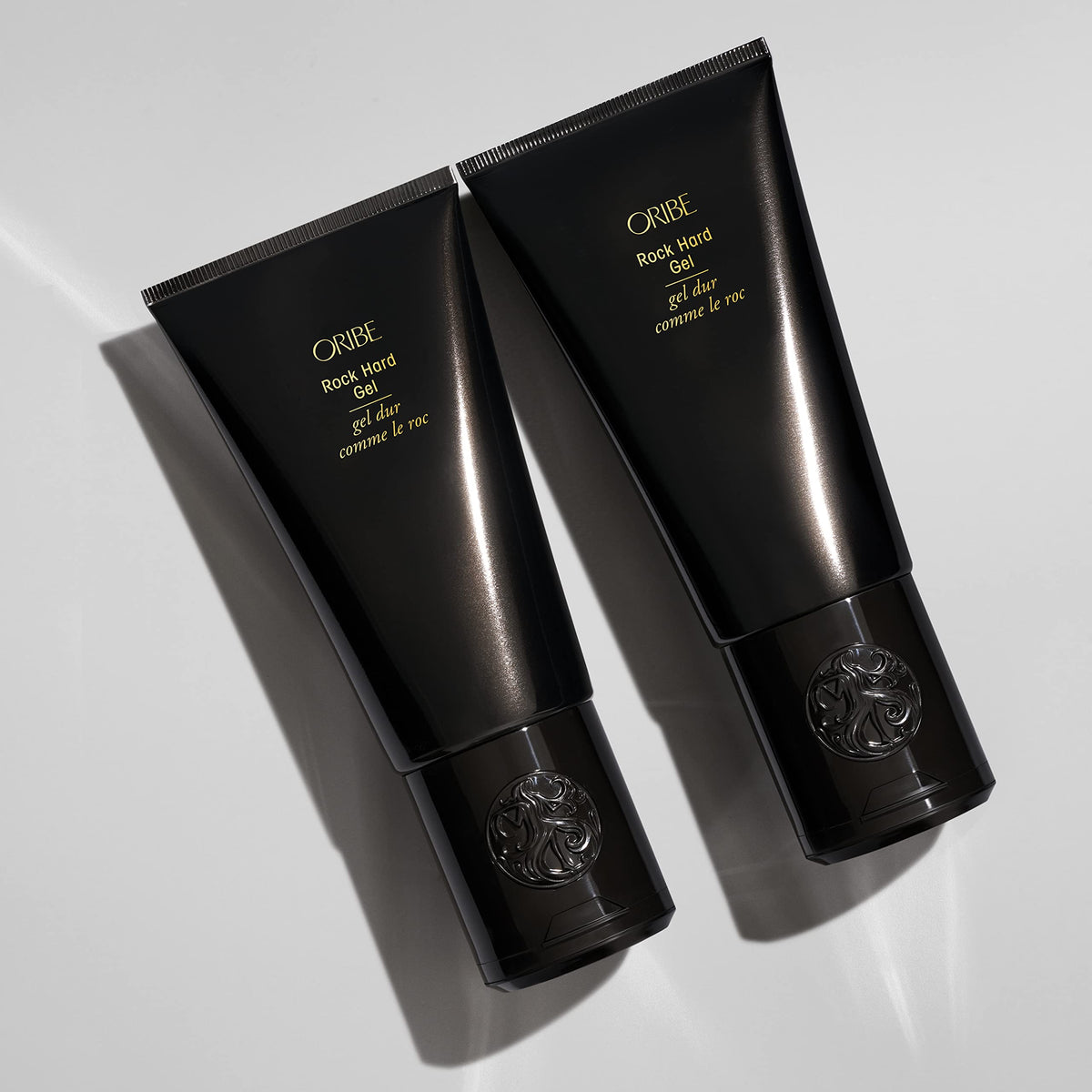 Oribe Rock Hard Gel in hand during styling demonstrating precise sculpting control