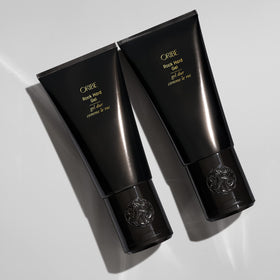 Oribe Rock Hard Gel in hand during styling demonstrating precise sculpting control