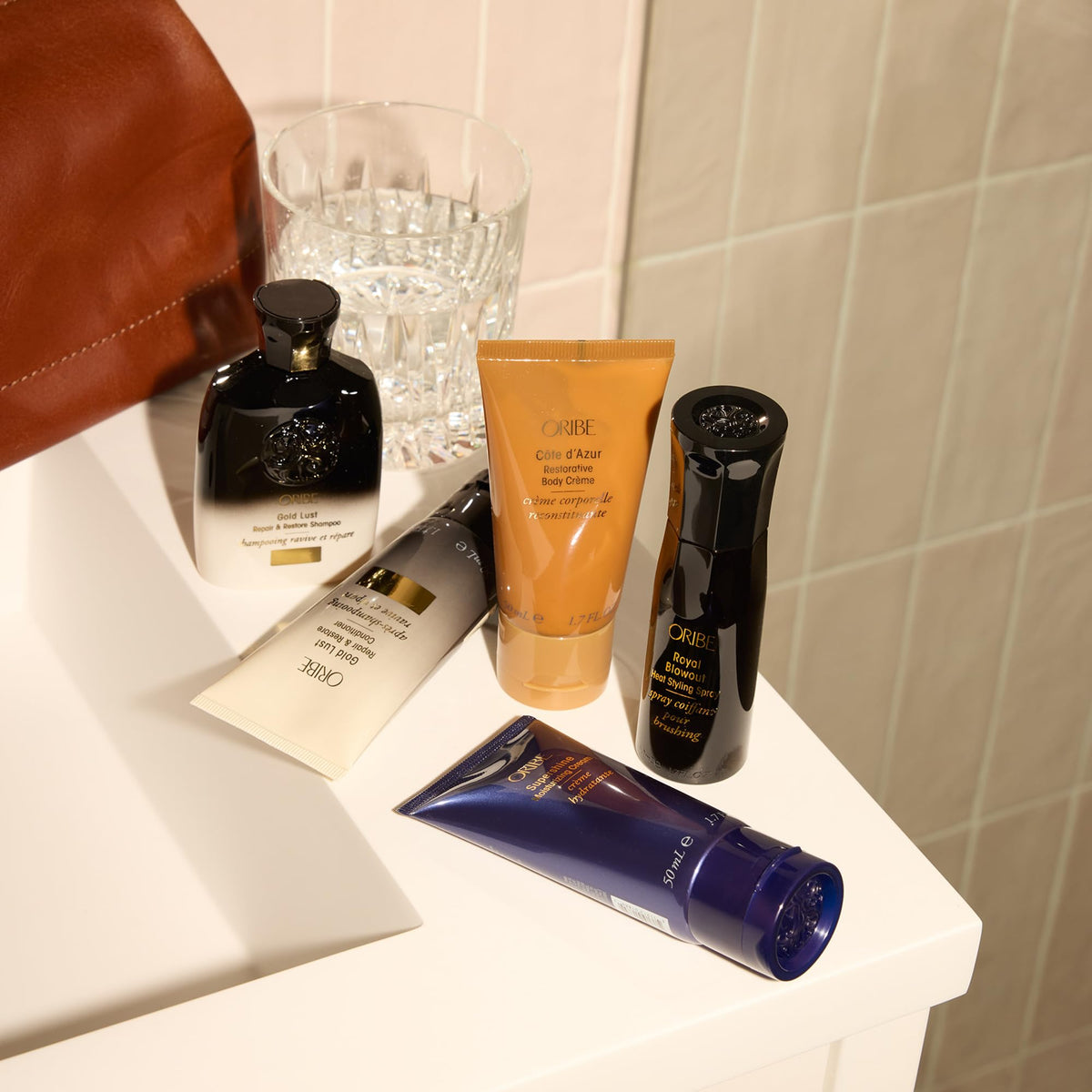 ORIBE spray being applied during blow-dry for heat protection