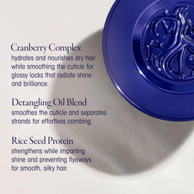 Oribe Run-Through texture close-up displaying lightweight creamy formula for smooth glide