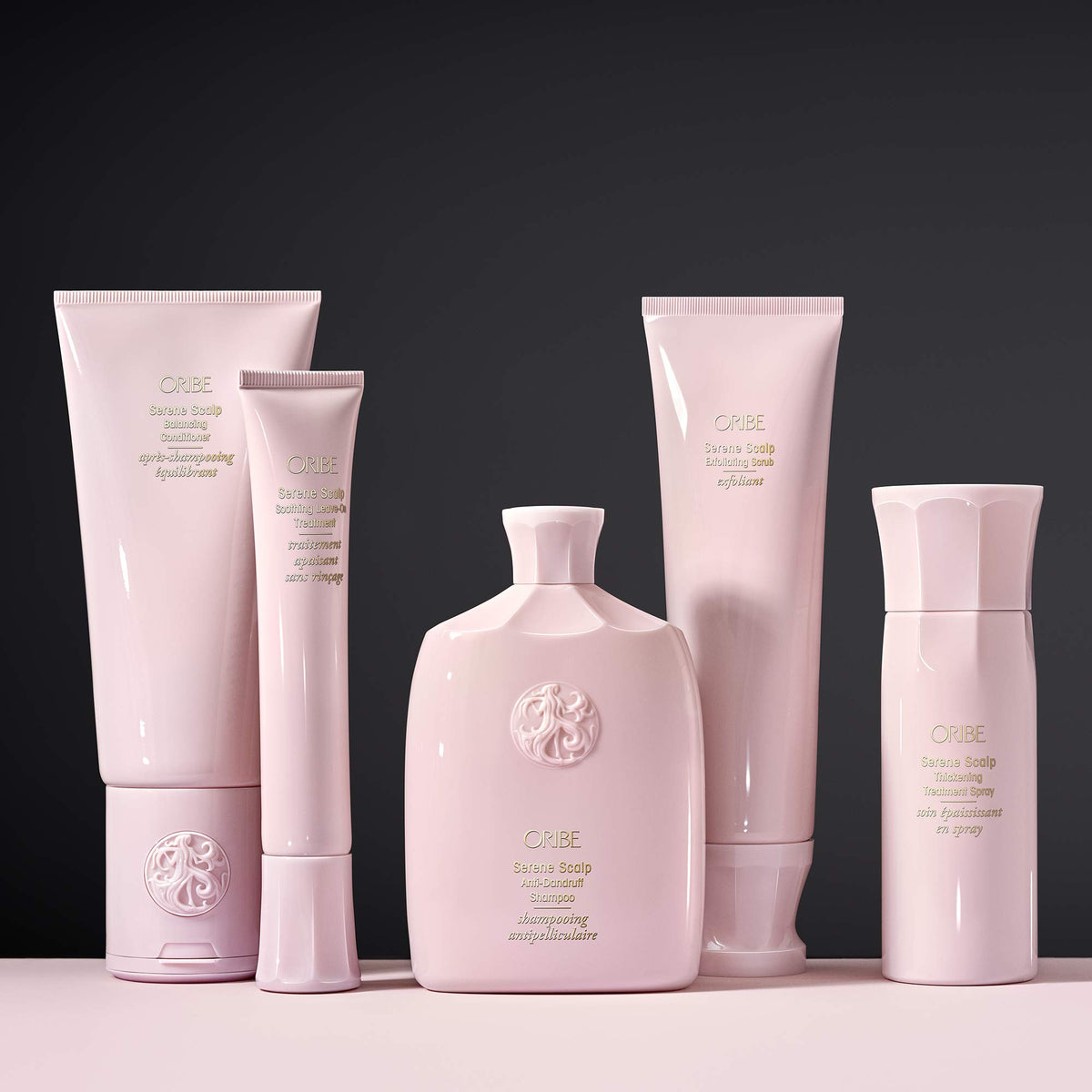 Oribe bottle staged on bathroom shelf signaling luxe daily routine