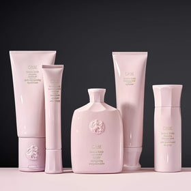Oribe bottle staged on bathroom shelf signaling luxe daily routine