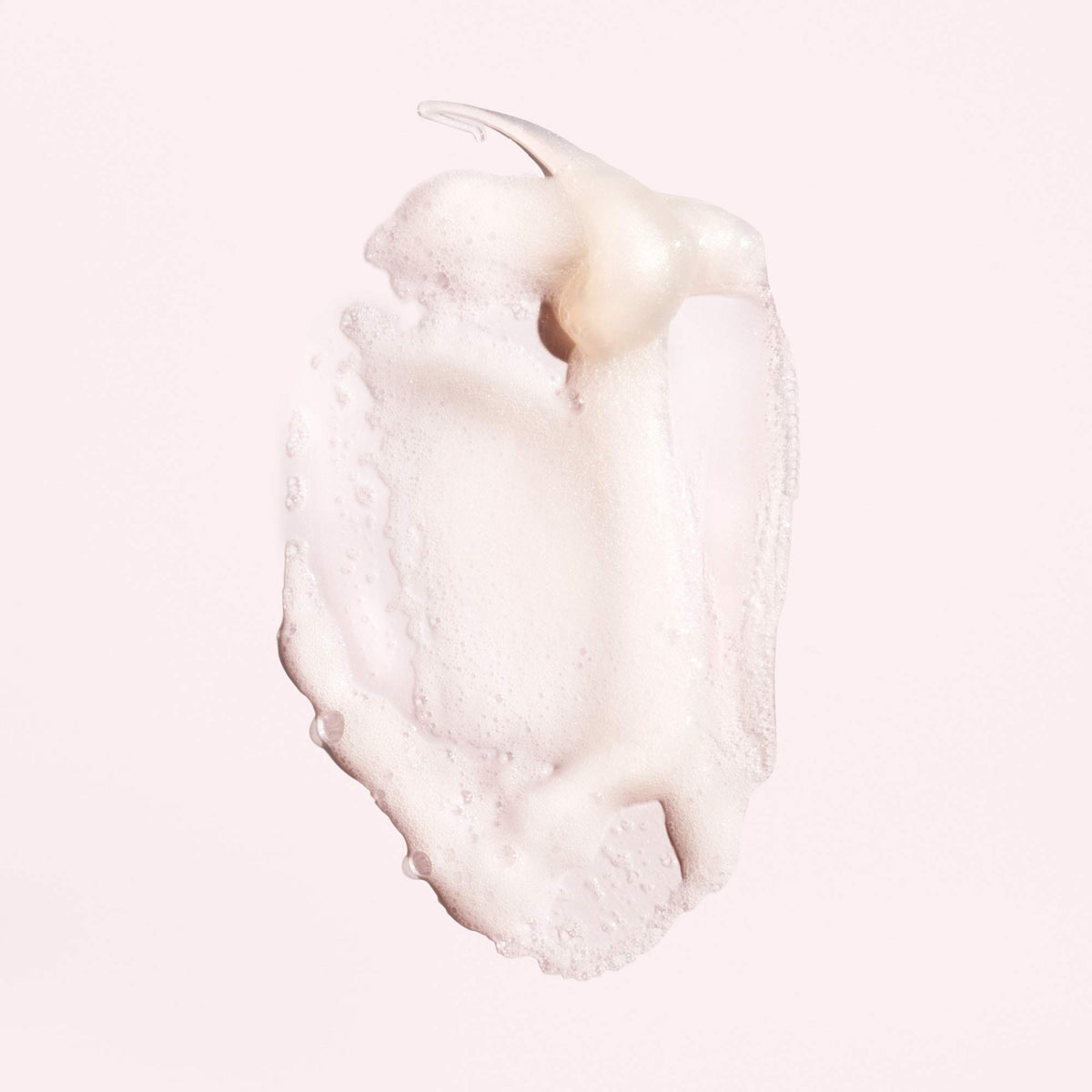 Oribe shampoo being dispensed demonstrating gentle foaming and control