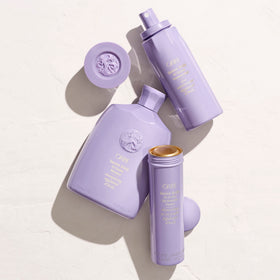 ORIBE 8.5 fl oz bottle beside common items to show true scale