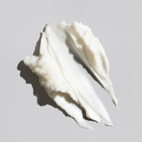 Oribe cream texture close-up demonstrating rich formula for deep moisture