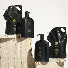 Pouring Oribe refill into a bottle illustrating simple transfer and reuse