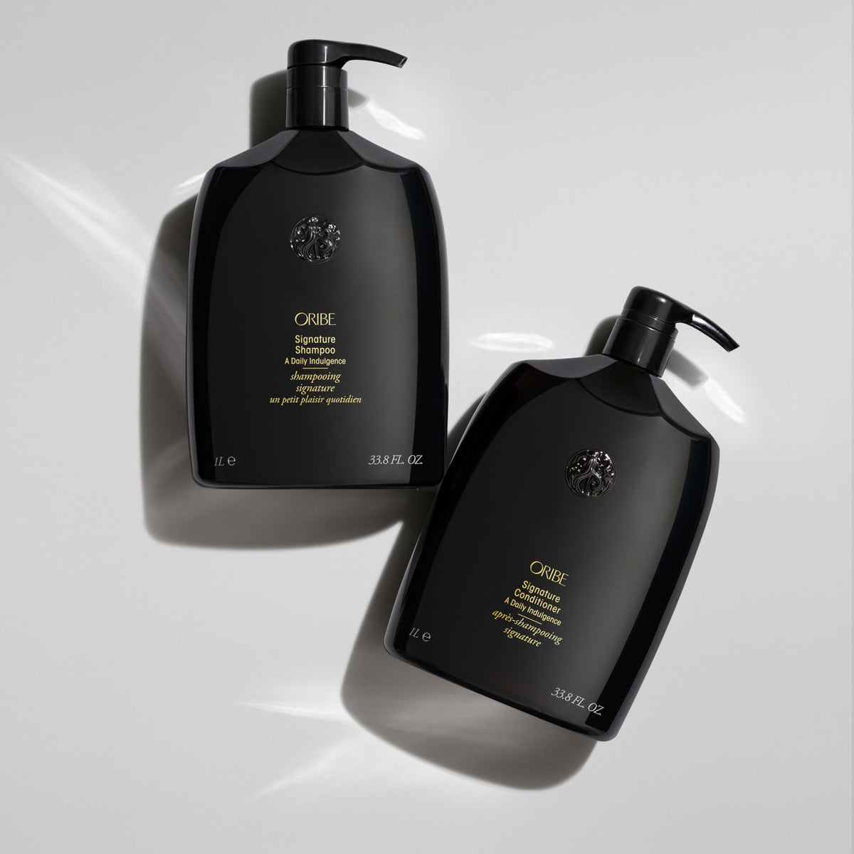 Close-up lather from Oribe signature shampoo demonstrating rich foam and cleanse