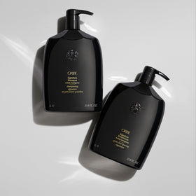 Close-up lather from Oribe signature shampoo demonstrating rich foam and cleanse
