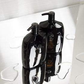 Ingredients and claims label on Oribe signature shampoo highlighting paraben-free benefit
