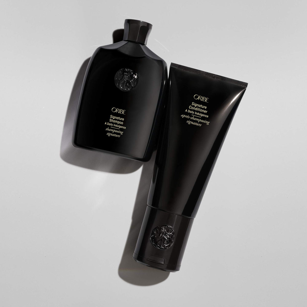 Oribe signature shampoo placed at a salon station showing professional-quality use