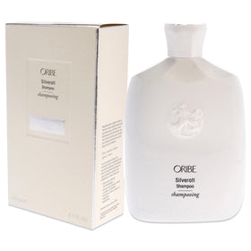Model washing silver hair with Oribe Silverati to reduce yellow tones