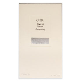 Oribe Silverati bottle next to ruler showing 8.5 oz scale for size